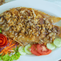 thai food deep fried ruby fish with crispy garlic white plate 43518 64